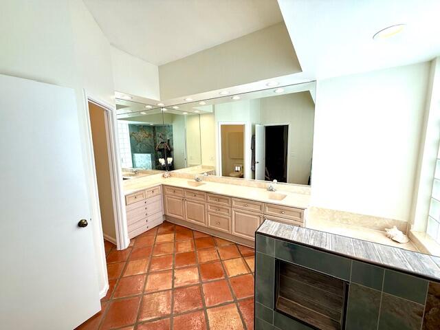 2409 Northwest 66th Drive Boca Raton, FL 33496 - Photo 5 of 15 a large bathroom with a sink and a large mirror