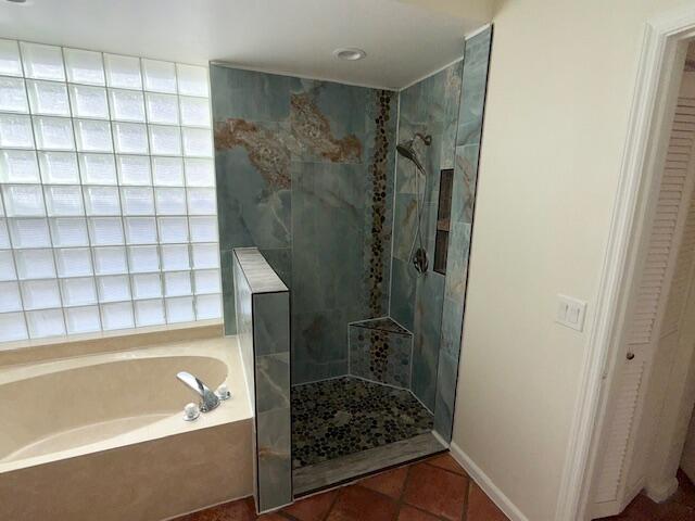 2409 Northwest 66th Drive Boca Raton, FL 33496 - Photo 6 of 15 a bathroom with a bathtub and shower