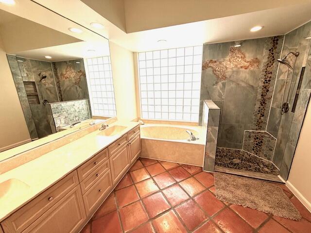 2409 Northwest 66th Drive Boca Raton, FL 33496 - Photo 7 of 15 a spacious bathroom with a granite countertop tub shower and sink