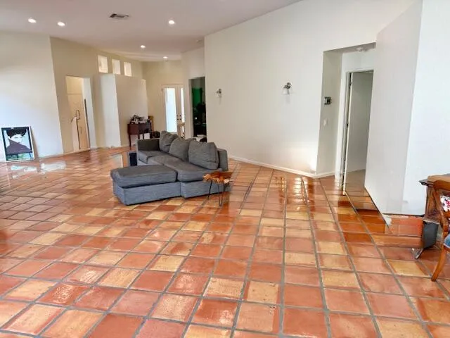 a view of a dining room with a table and chairs