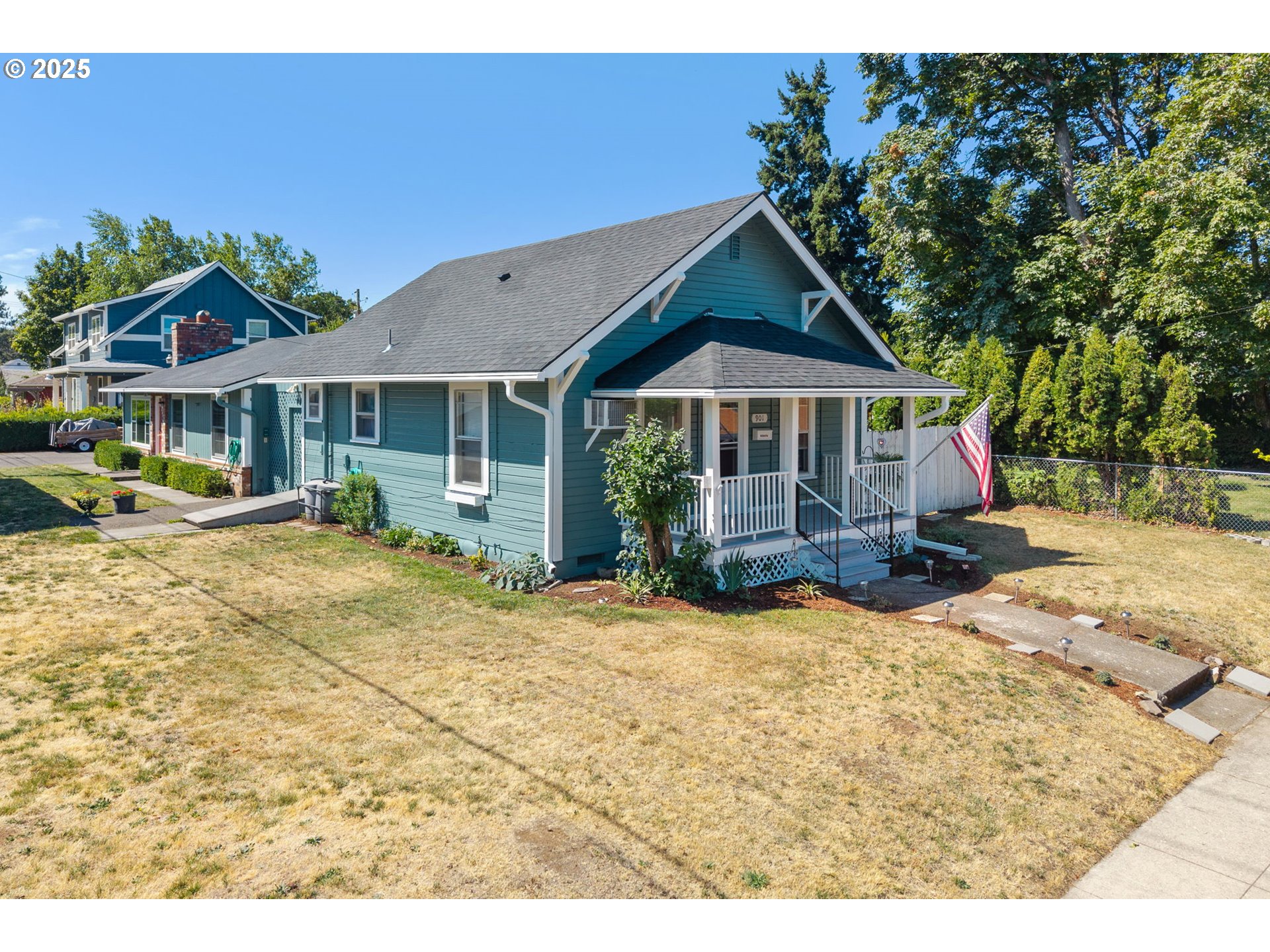 1108 9th Street Hood River, OR 97031 - Photo 1 of 44 a front view of a house with a yard
