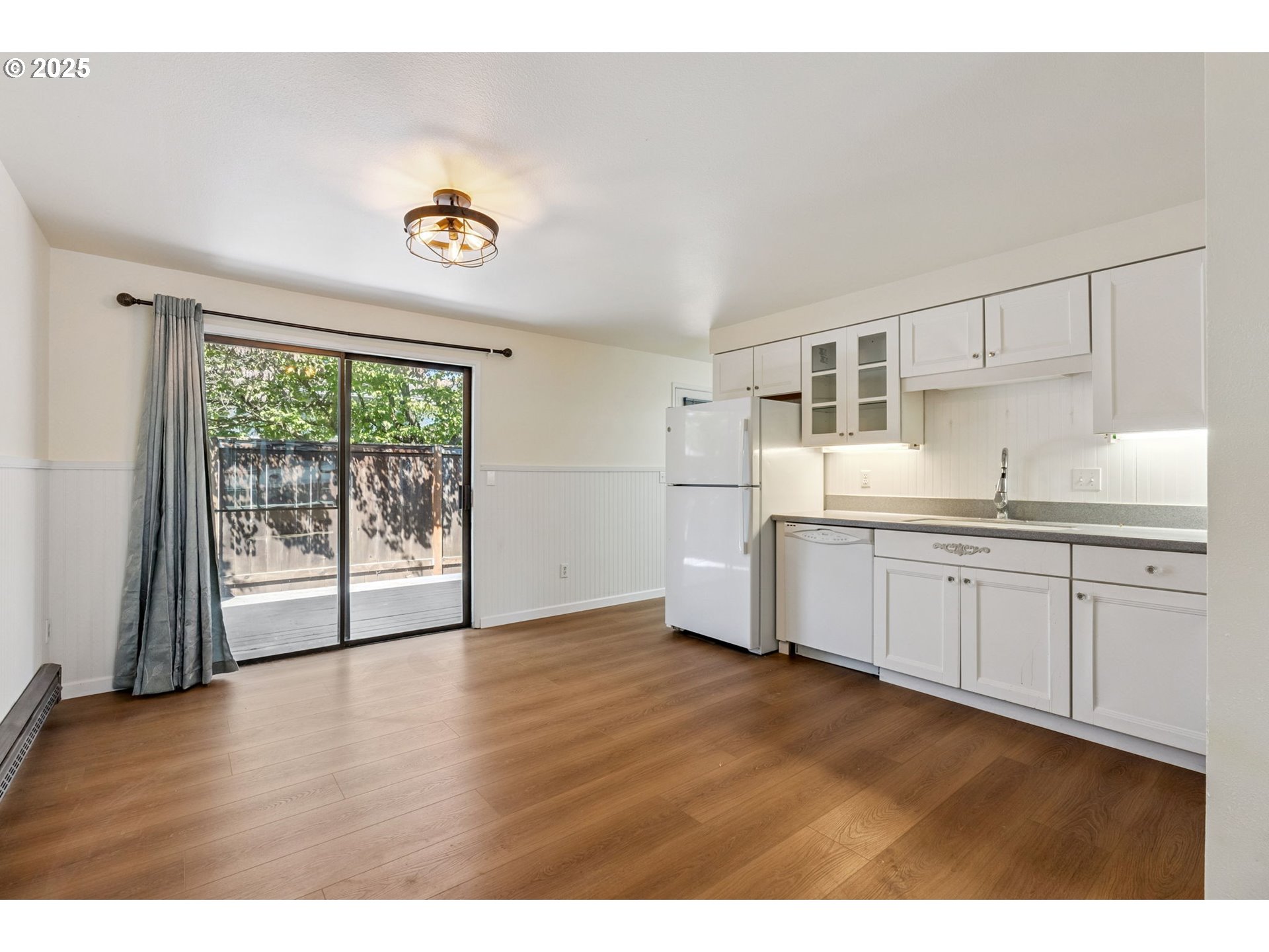1108 9th Street Hood River, OR 97031 - Photo 11 of 44 a kitchen with granite countertop a stove a sink and a refrigerator
