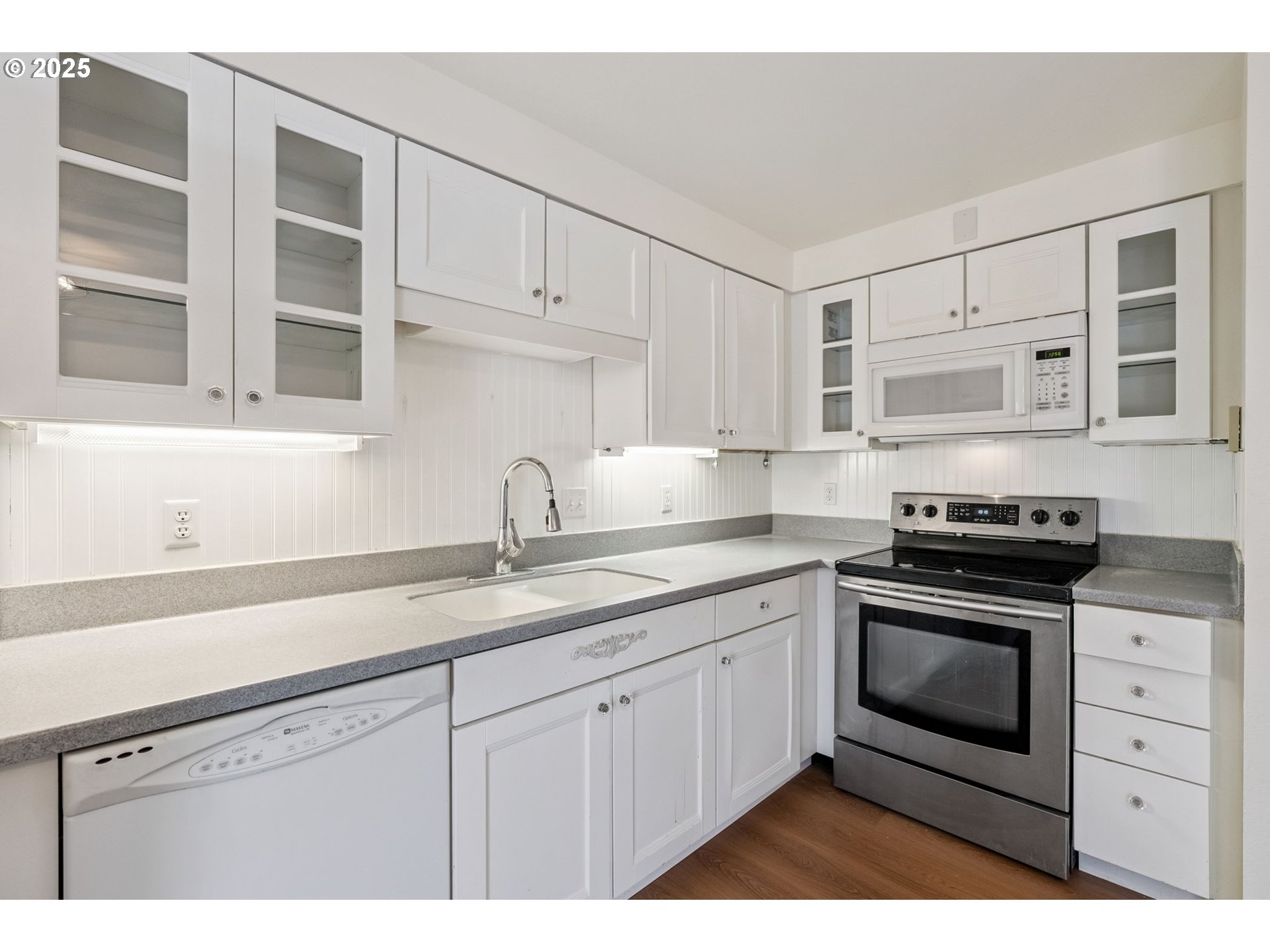 1108 9th Street Hood River, OR 97031 - Photo 13 of 44 a kitchen with cabinets stainless steel appliances and a sink
