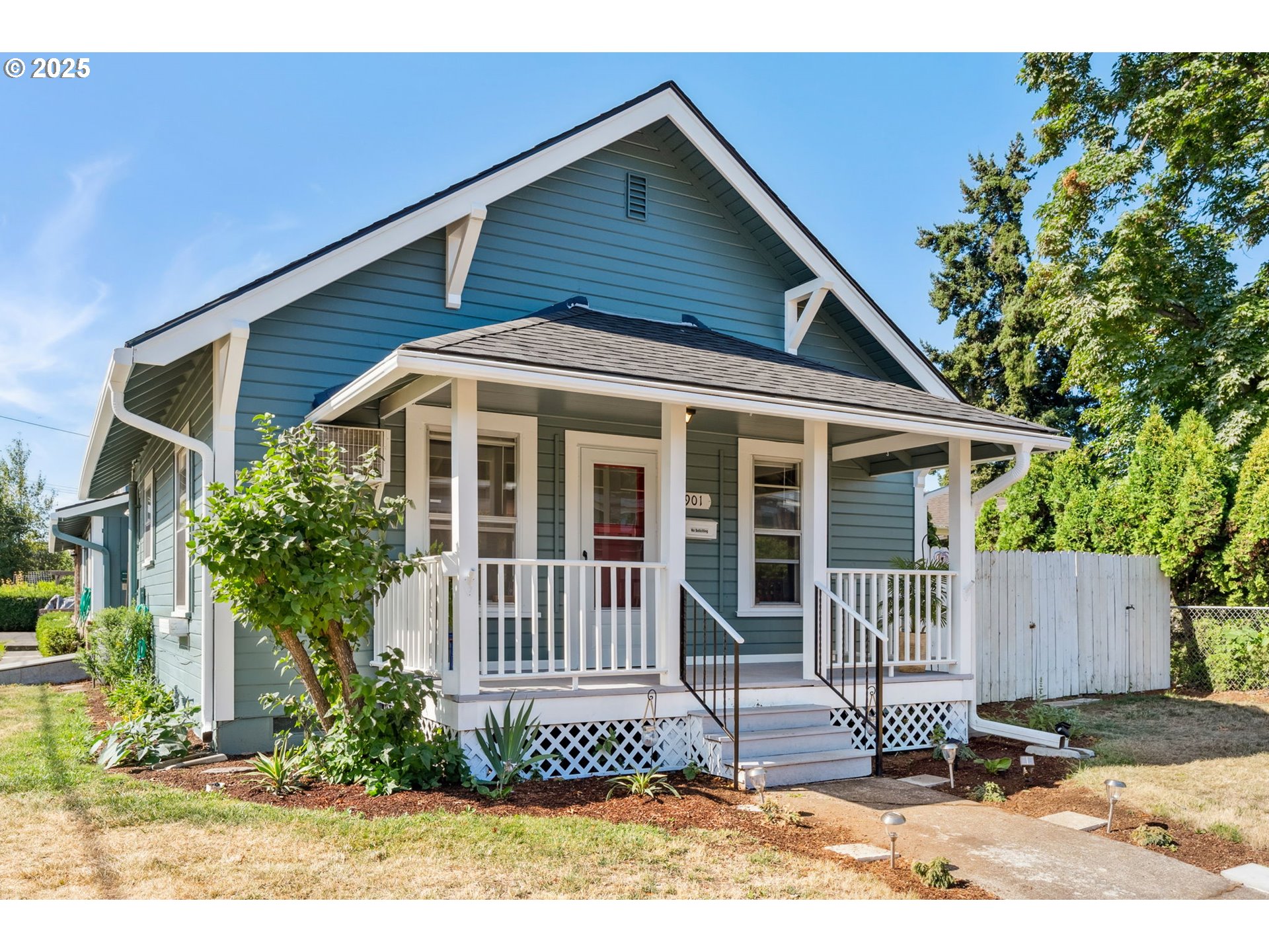 1108 9th Street Hood River, OR 97031 - Photo 2 of 44 a front view of a house with a garden