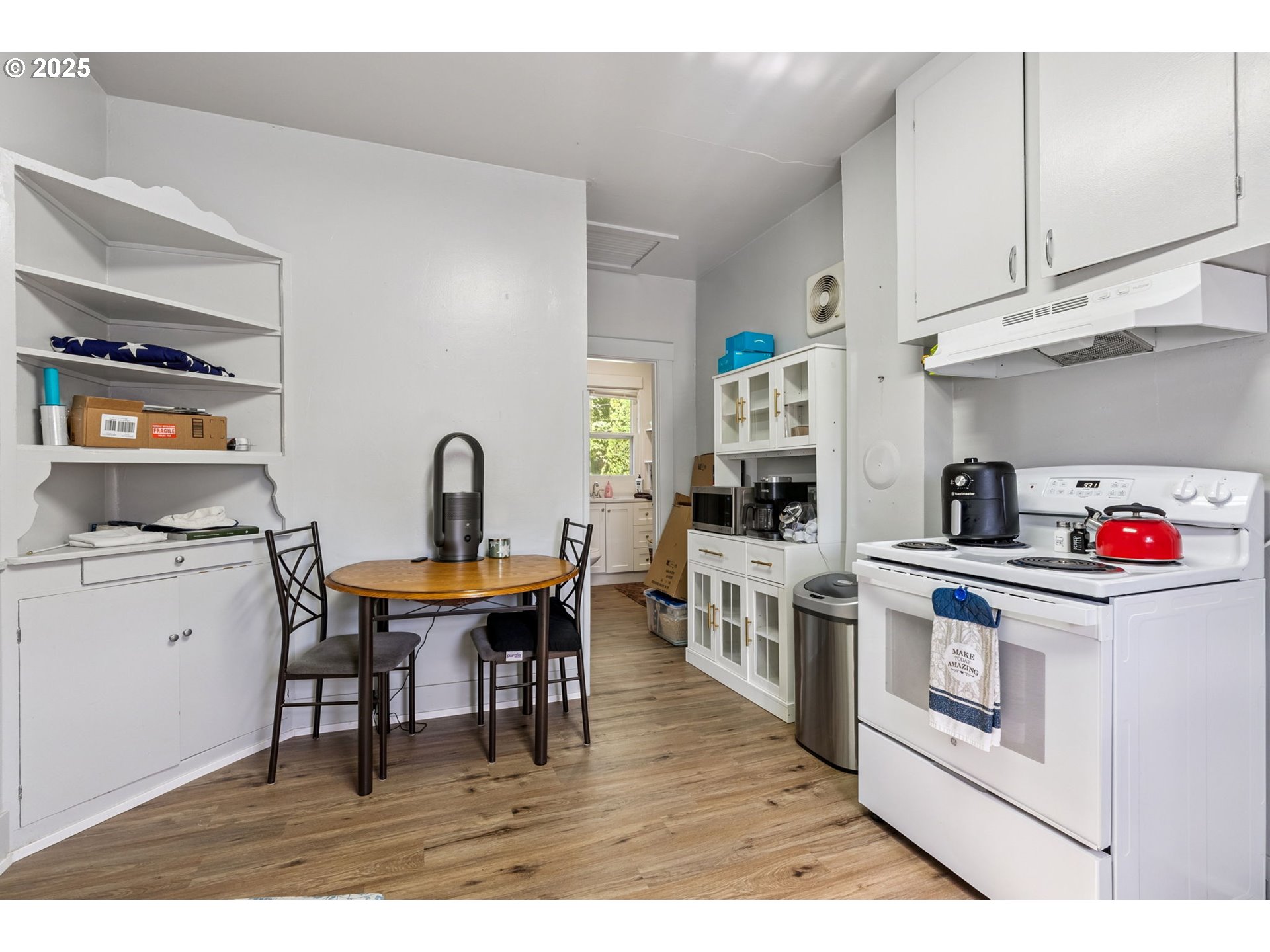 1108 9th Street Hood River, OR 97031 - Photo 25 of 44 a kitchen with stainless steel appliances granite countertop a white cabinets and stove top oven