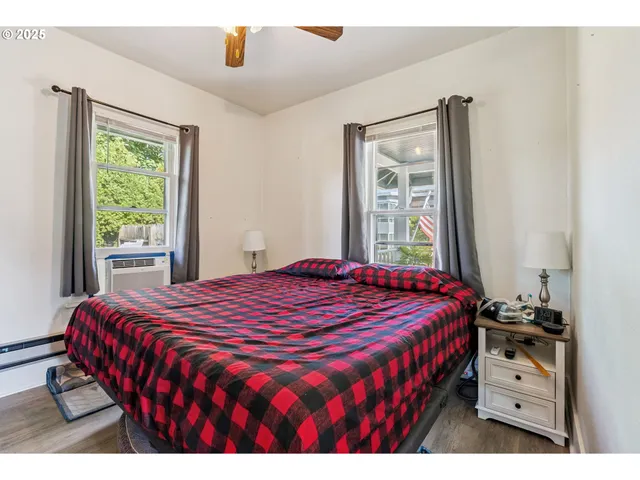 a bedroom with a bed and a window