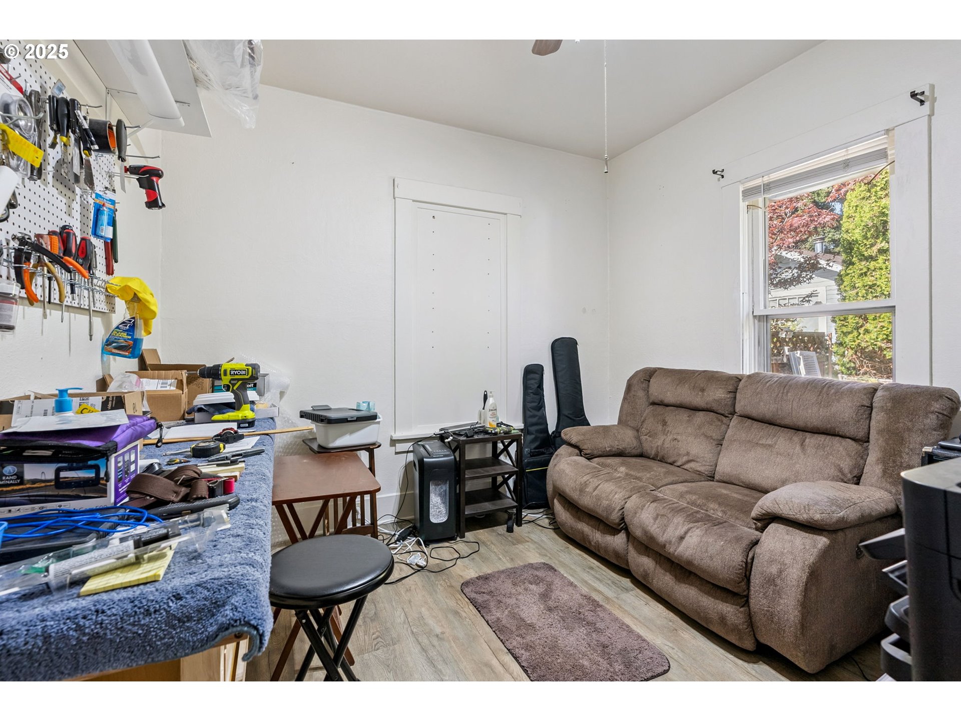 1108 9th Street Hood River, OR 97031 - Photo 28 of 44 a living room with furniture and a window
