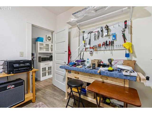 a room with furniture and a kitchen view