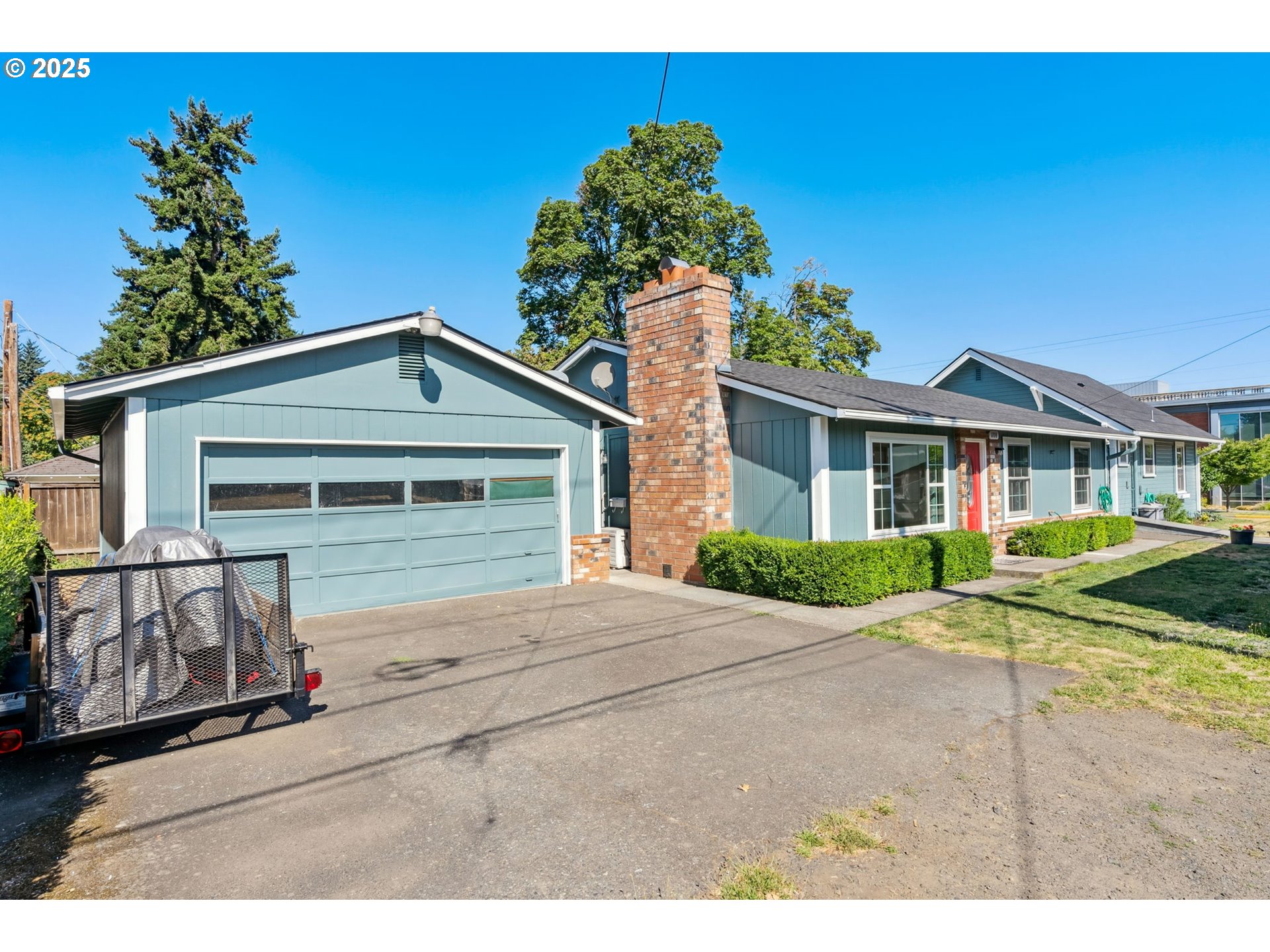 1108 9th Street Hood River, OR 97031 - Photo 35 of 44 a front view of a house with garden