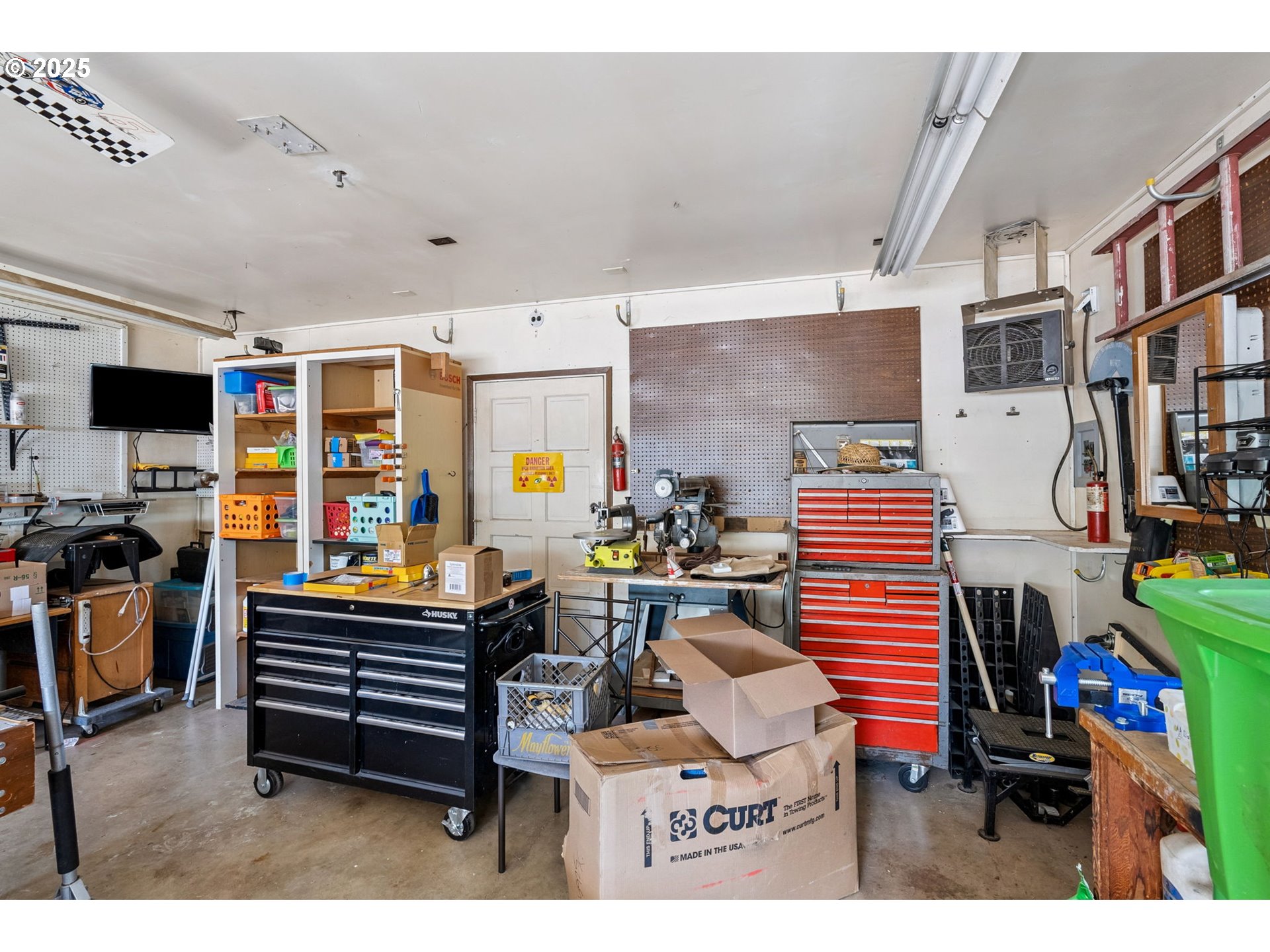 1108 9th Street Hood River, OR 97031 - Photo 38 of 44 a room with furniture a flat screen tv and a fireplace