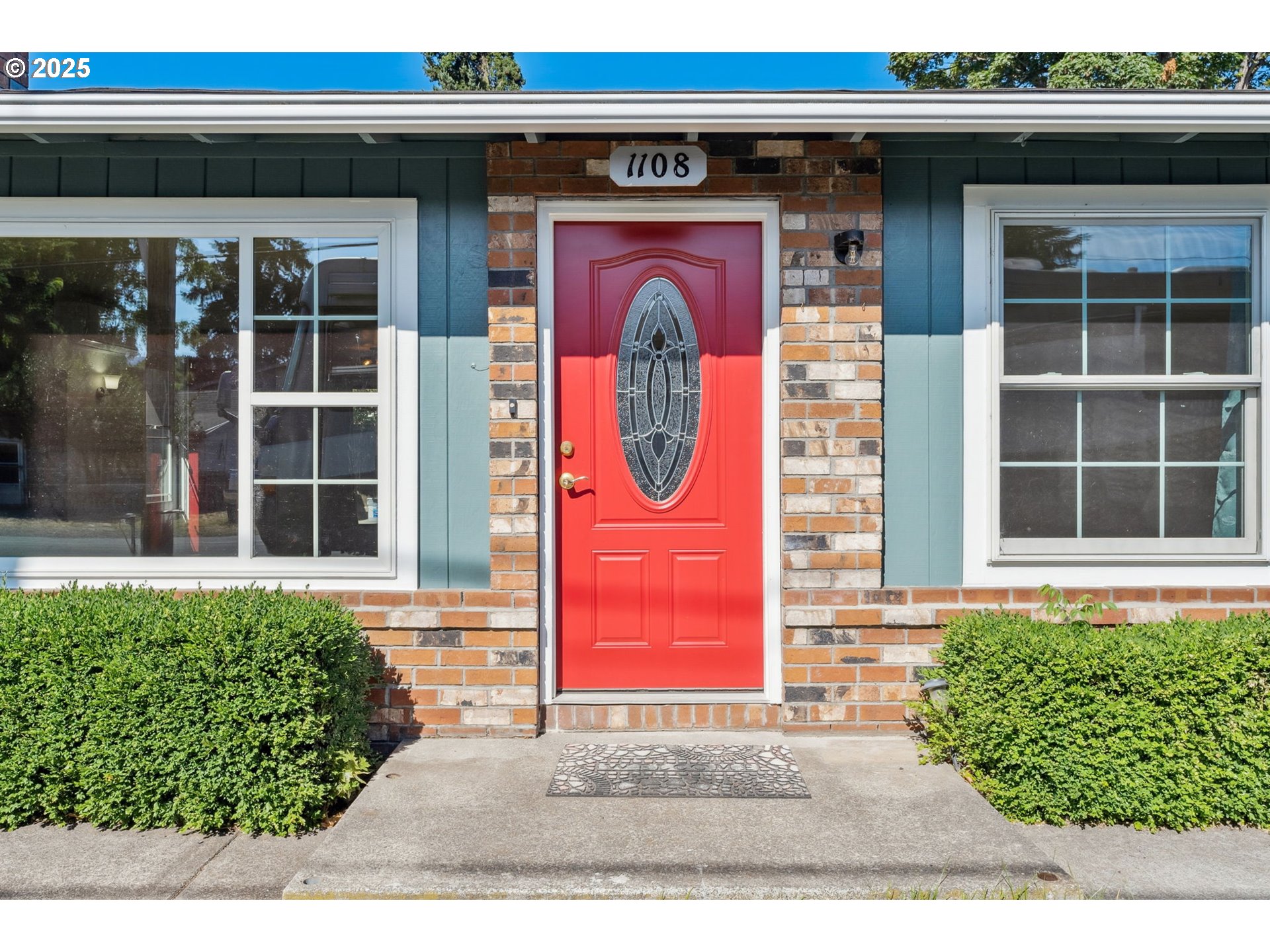 1108 9th Street Hood River, OR 97031 - Photo 40 of 44 a front view of a house with a garden