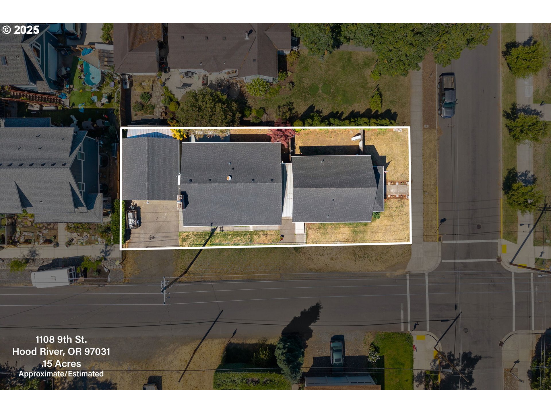 1108 9th Street Hood River, OR 97031 - Photo 4 of 44 an aerial view of a house with a yard