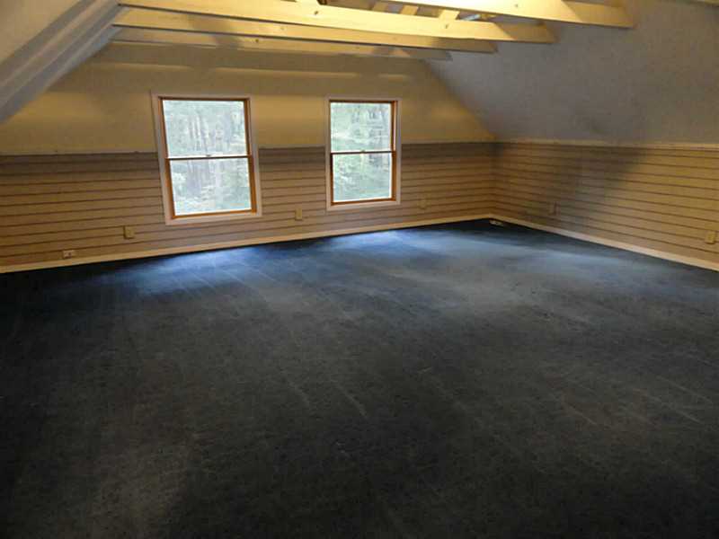 113 Burlingame Road Smithfield, RI 02917 - Photo 3 of 25 Bonus Room. Another Perspective Of The Rec Room Shows Its Good Size And Also Features Large, Double Windows For Lots Of Natural Light.