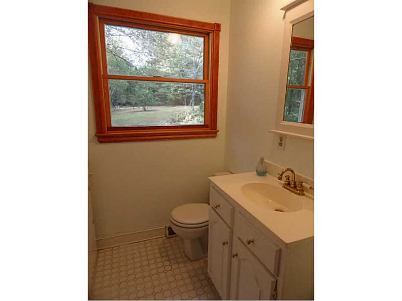 113 Burlingame Road Smithfield, RI 02917 - Photo 9 of 25 Bathroom. This Half Bath Is Located Off The Kitchen For Convenience And Doubles As A Laundry Room.