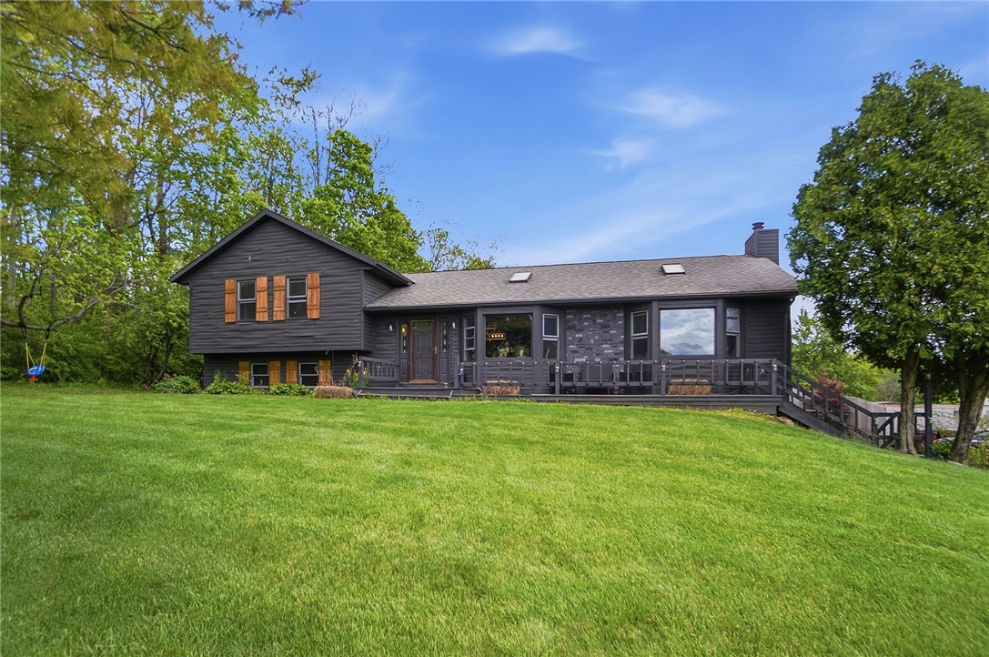 An inviting exterior with a wide-open lawn offers serene views and ample outdoor space.