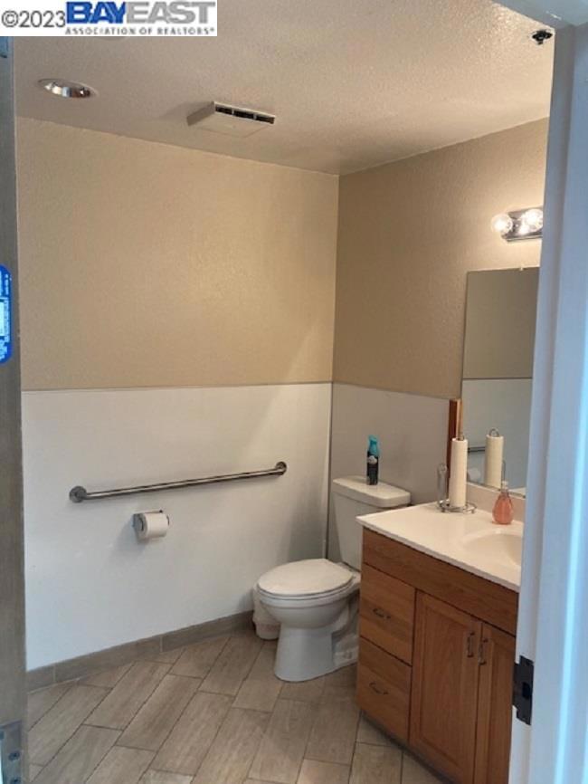4749 Bennett Drive Livermore, CA 94551 - Photo 15 of 27 a bathroom with a toilet a sink and mirror