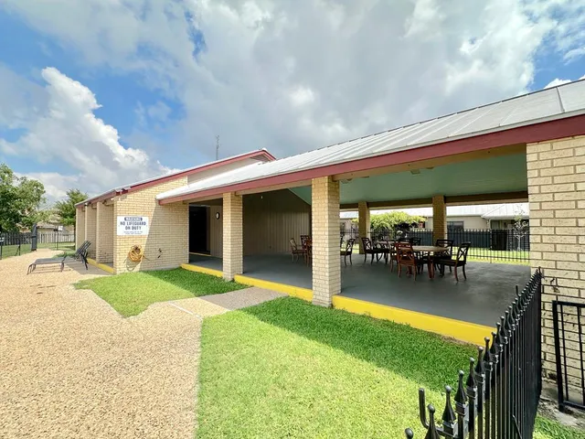 a front view of house with yard porch and outdoor seating