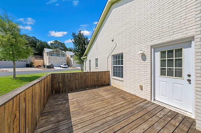 a balcony with view of the house