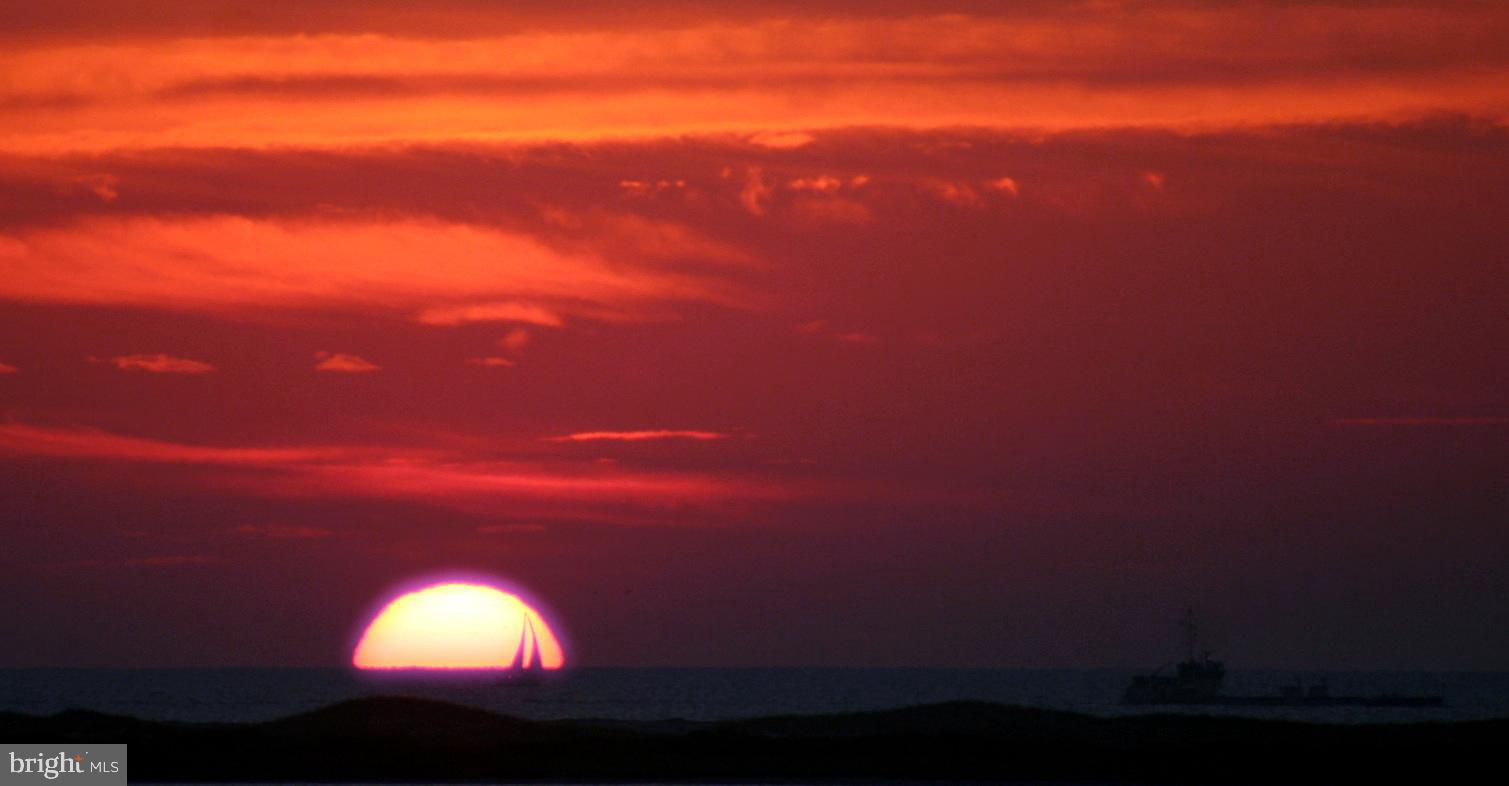 12345 Snug Harbor Road Berlin, MD 21811 - Photo 57 of 80 Ocean Sunrise with Sailboat-Taken from top fl deck