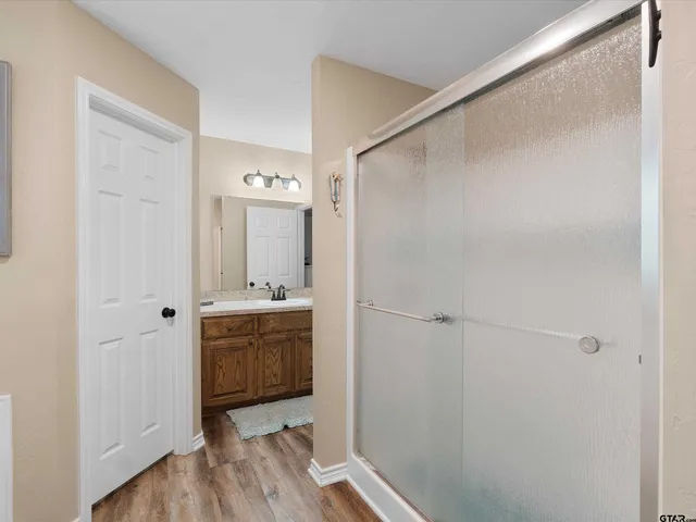 a bathroom with a sink and mirror