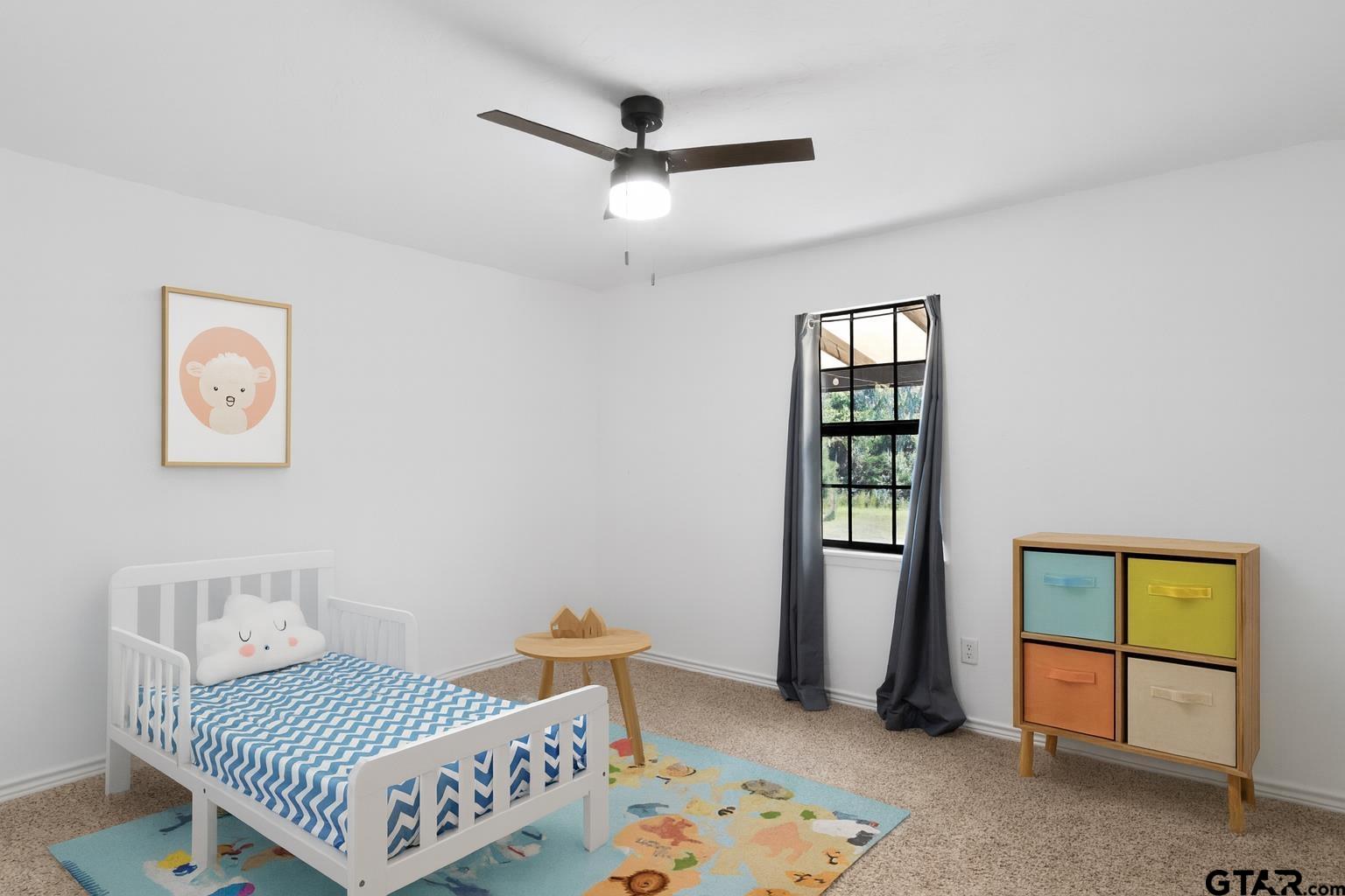 1832 FM 2906 Longview, TX 75603 - Photo 19 of 42 a bedroom with a bed and a window