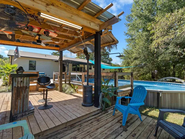 a view of a chairs and table on the deck