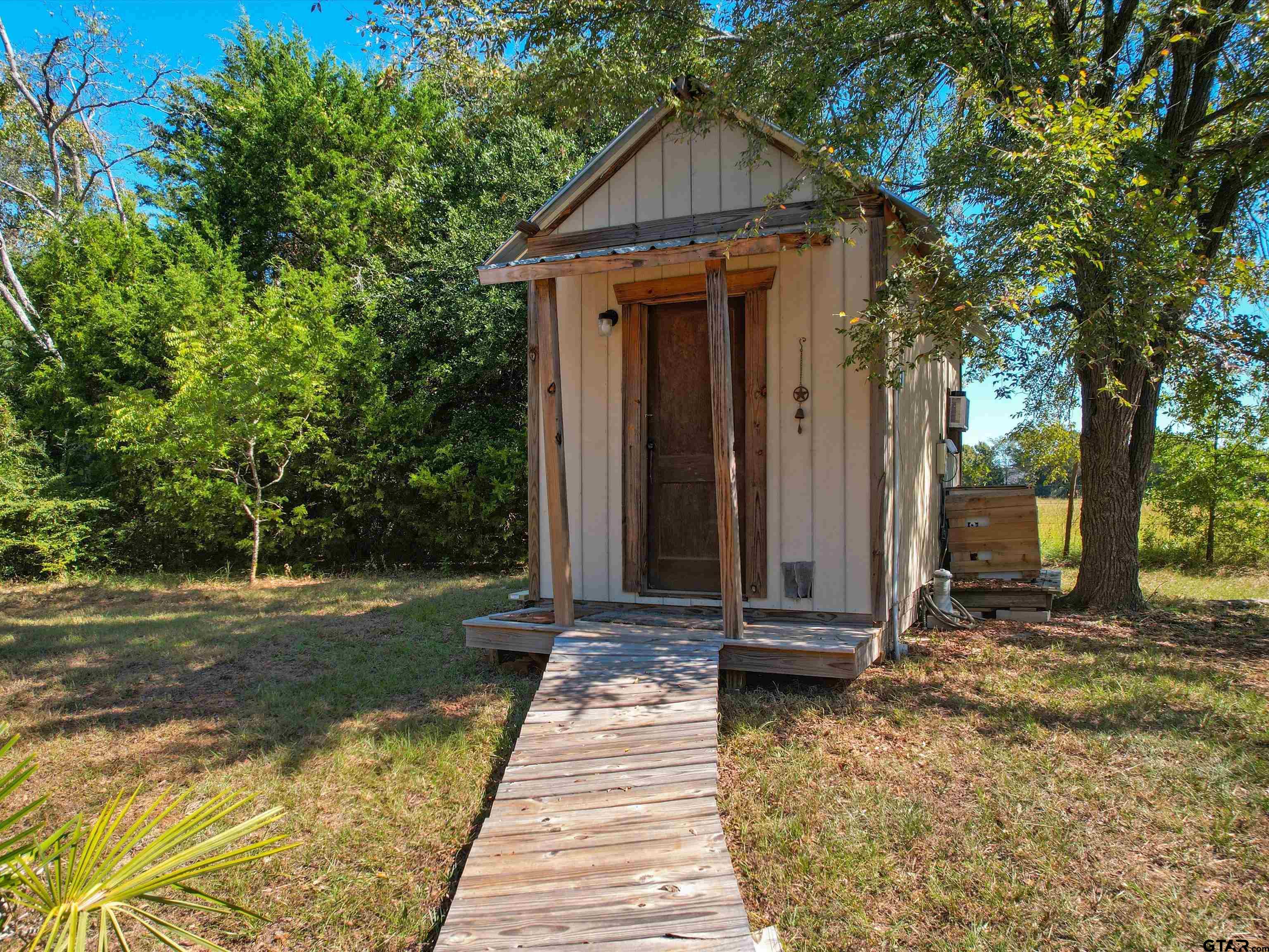 1832 FM 2906 Longview, TX 75603 - Photo 32 of 42 a front view of a house with a yard