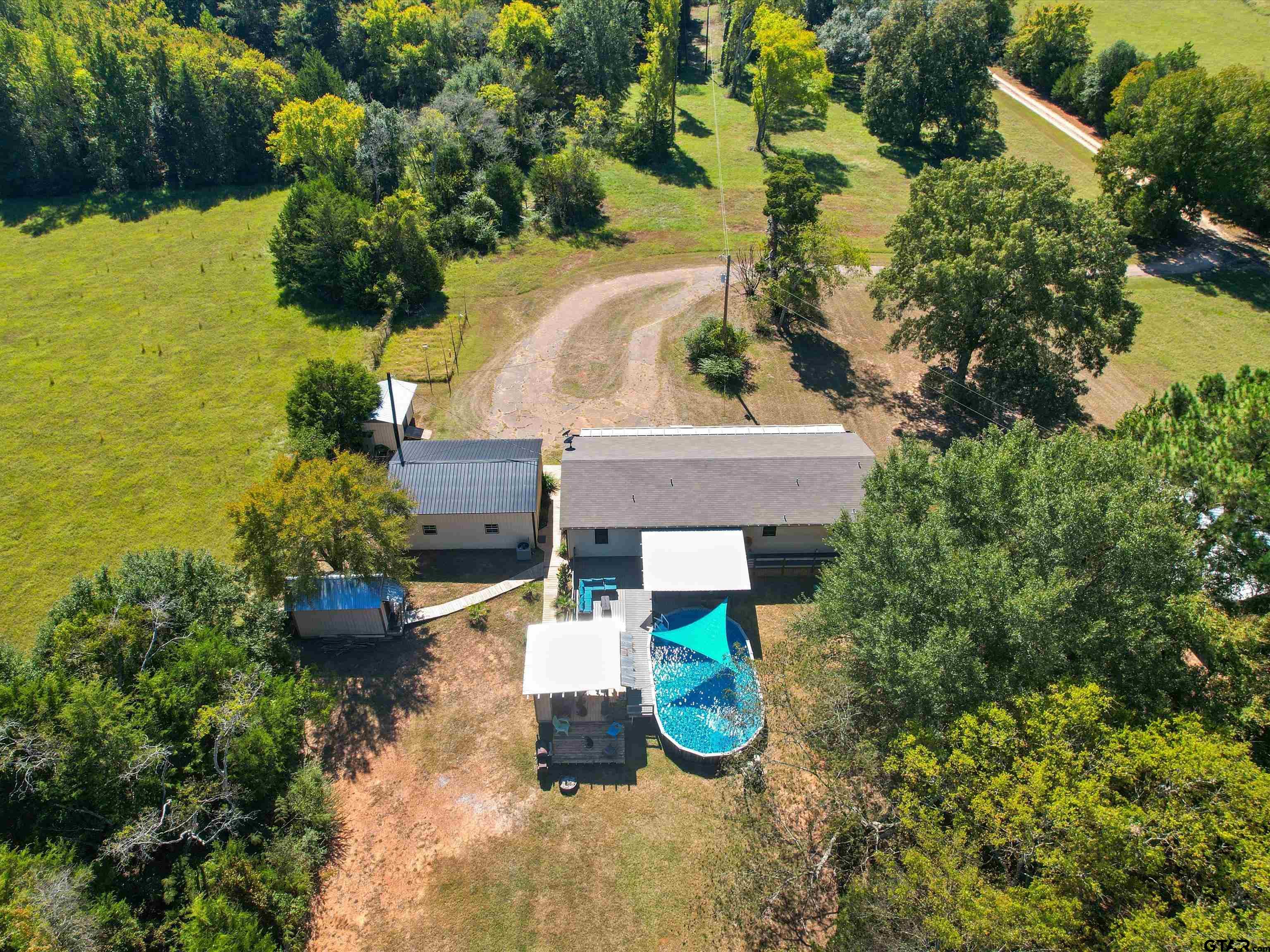 1832 FM 2906 Longview, TX 75603 - Photo 36 of 42 an aerial view of a house with yard swimming pool and outdoor seating