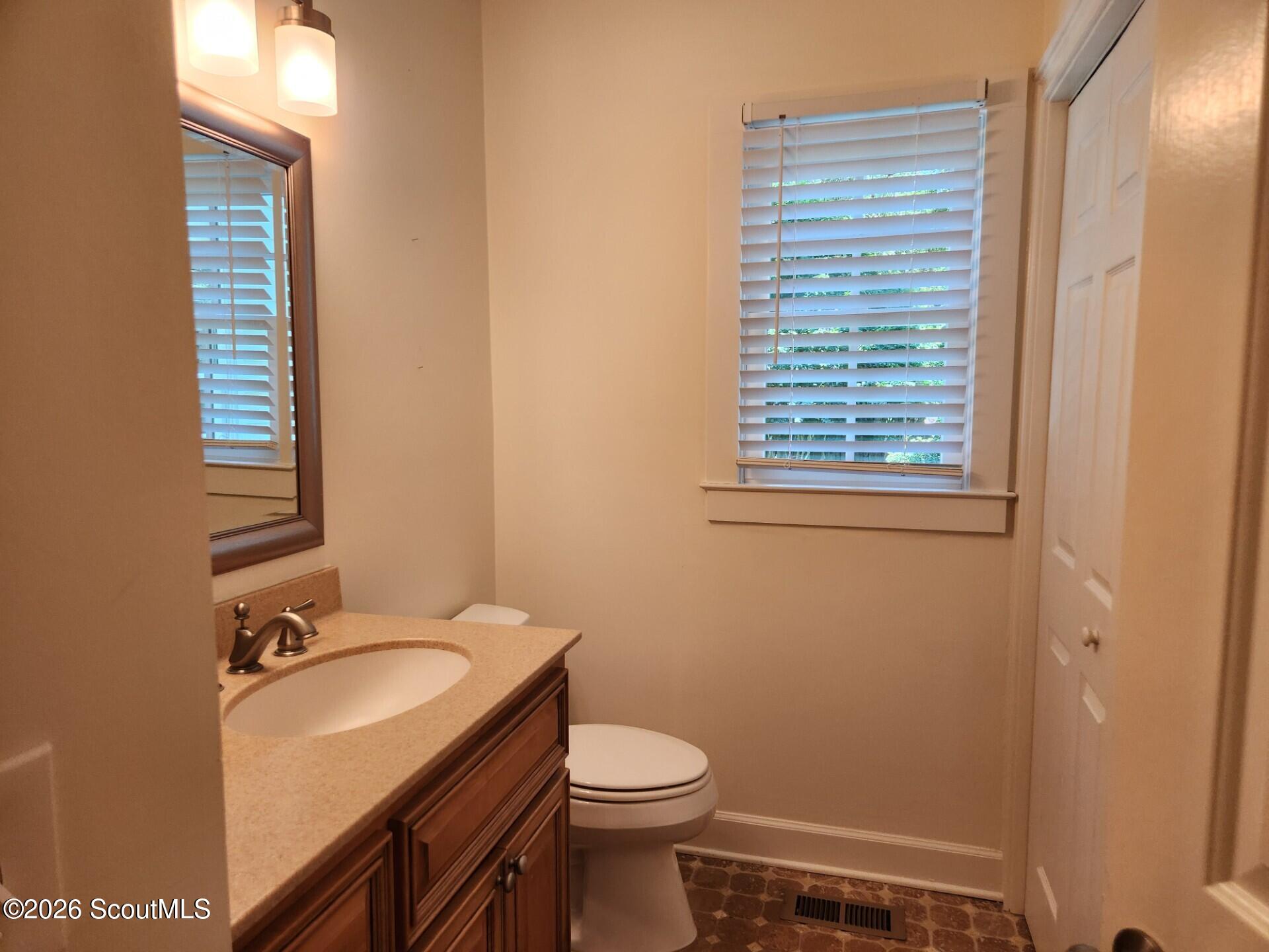 110 Jacobs Road St. Simons Island, GA 31522 - Photo 9 of 27 Downstairs Half Bath and Laundry