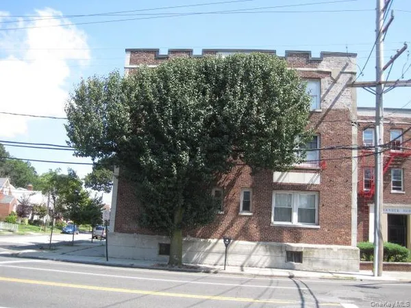 a view of a building with a tree