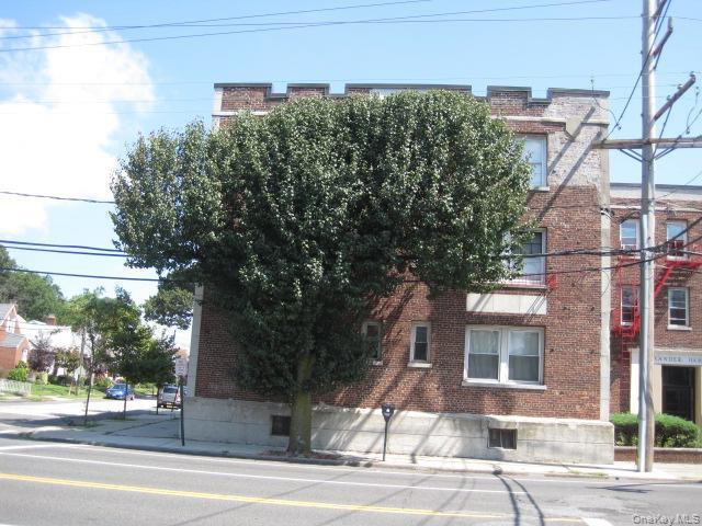 a view of a building with a tree