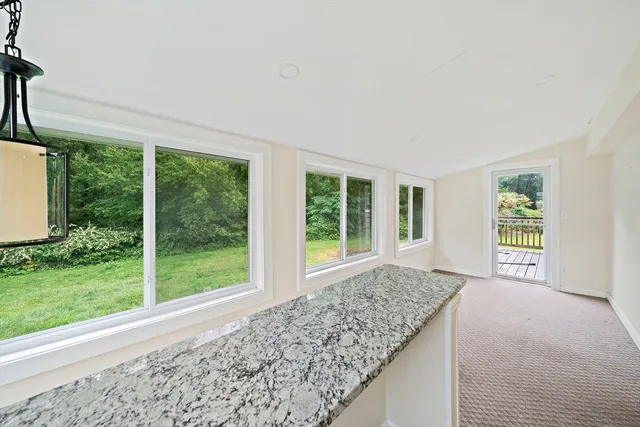 a view of a room with a large window