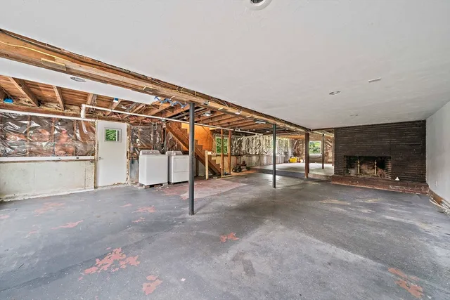 a view of empty room with a fireplace