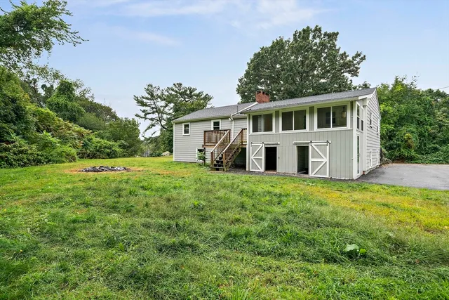 a front view of a house with a garden