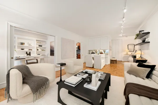 a living room with furniture and a table