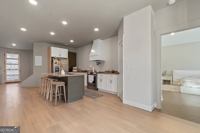 a kitchen with a table and chairs in it