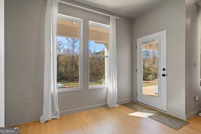 a view of an empty room with a window