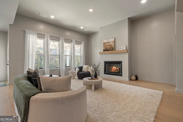 a living room with furniture and a fireplace