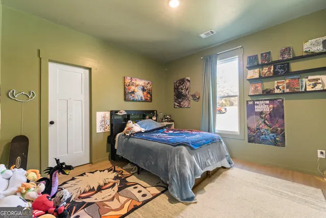 a bedroom with a bed and cabinets