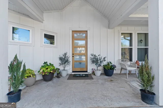a potted plant sitting in front of a house