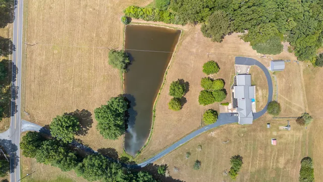 a view of a livingroom with furniture and a window