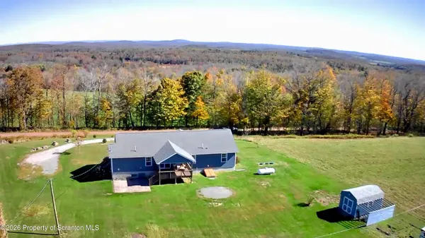 a view of a house with big yard