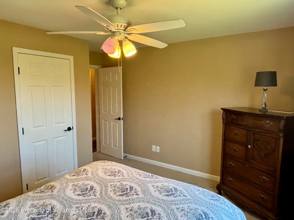 a view of room with workspace and a window