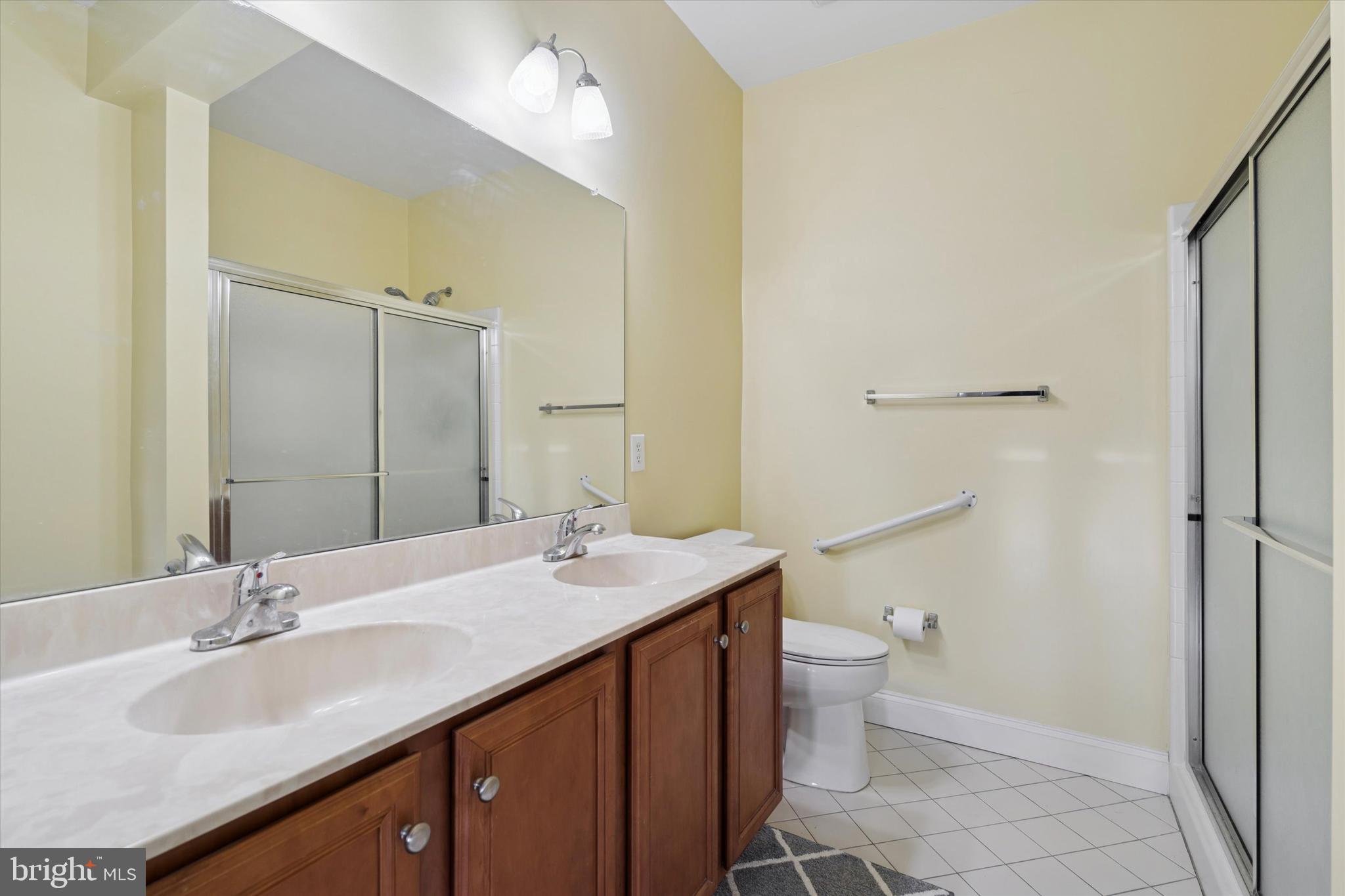 124 Bucktown Xing Road Pottstown, PA 19465 - Photo 13 of 15 a bathroom with a sink a toilet a shower and a mirror
