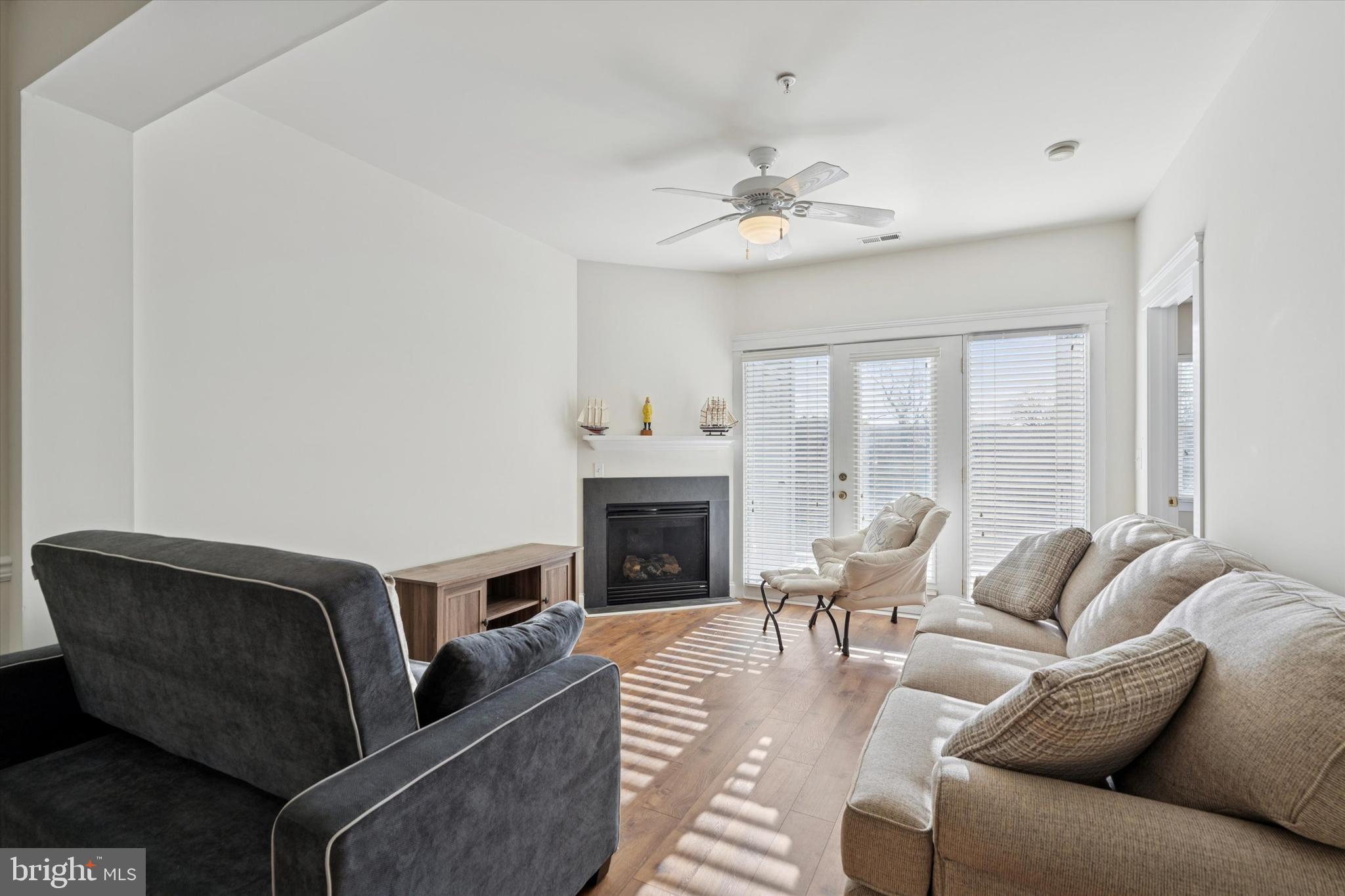 124 Bucktown Xing Road Pottstown, PA 19465 - Photo 2 of 15 a living room with furniture a fireplace and a chandelier