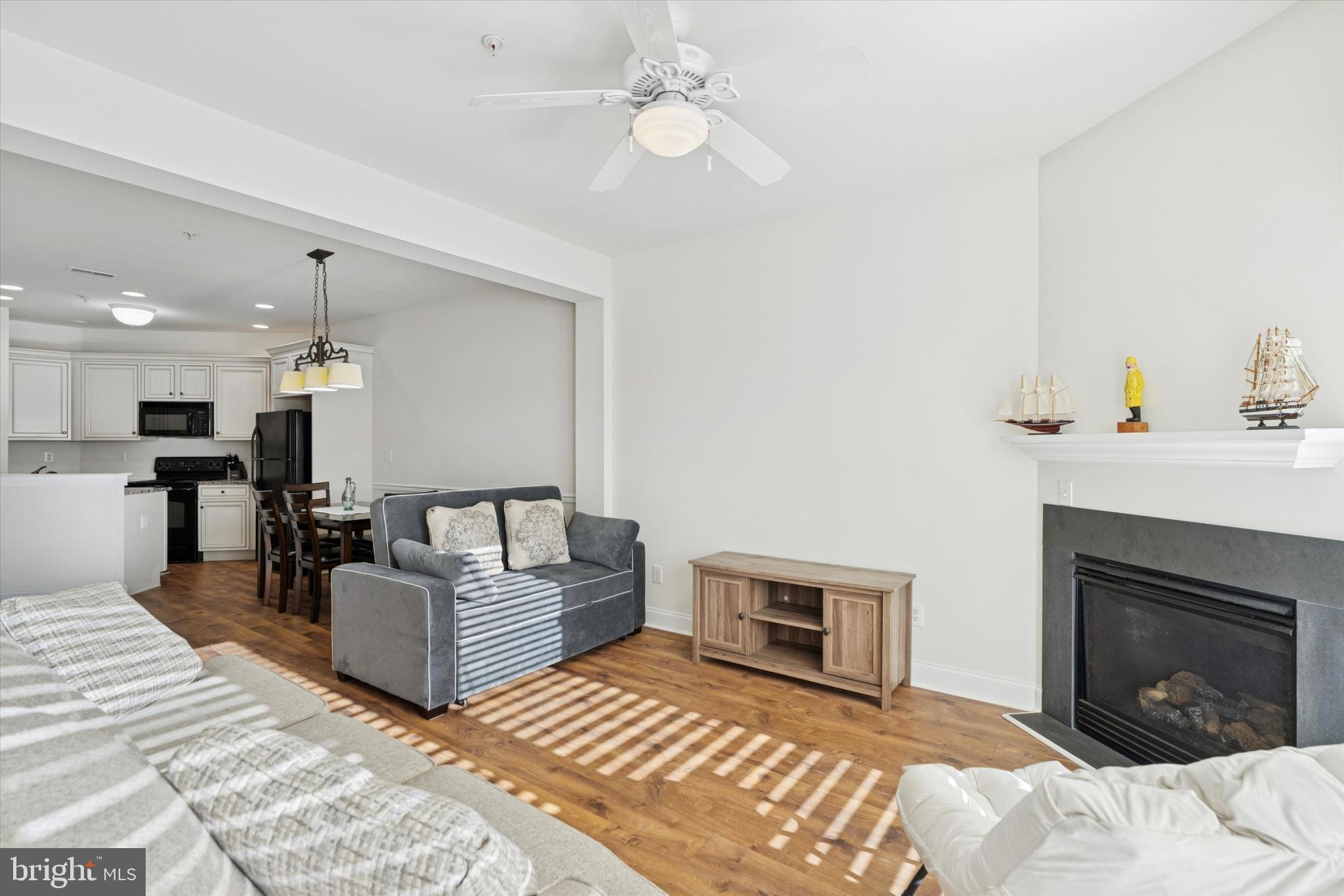 124 Bucktown Xing Road Pottstown, PA 19465 - Photo 4 of 15 a living room with furniture a fireplace and a chandelier