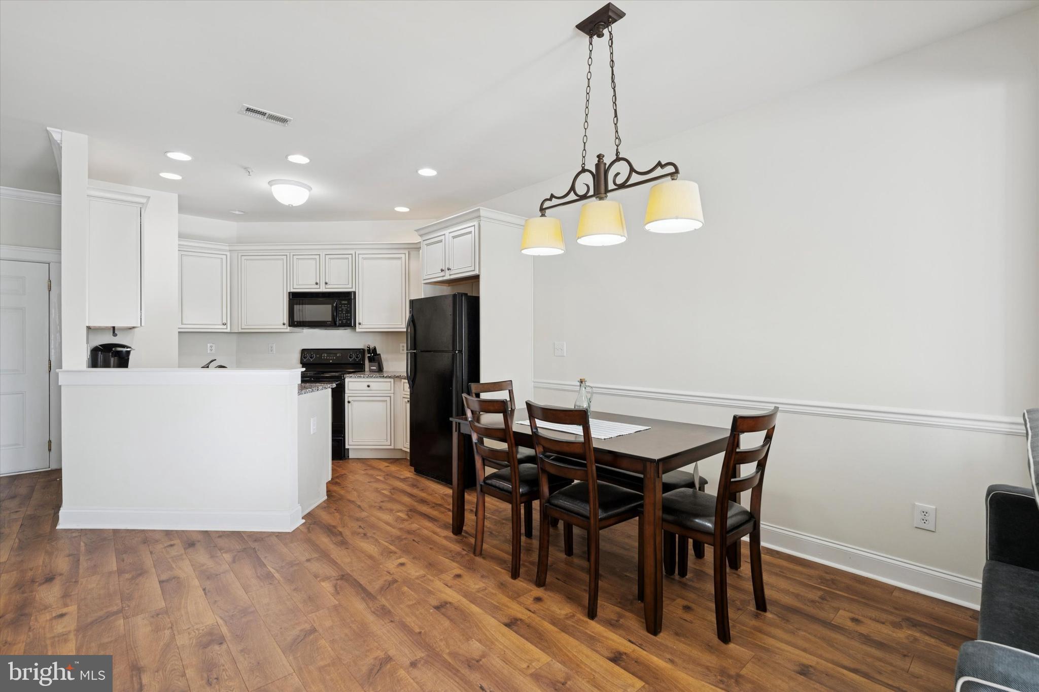 124 Bucktown Xing Road Pottstown, PA 19465 - Photo 6 of 15 a view of a dining room with furniture and wooden floor