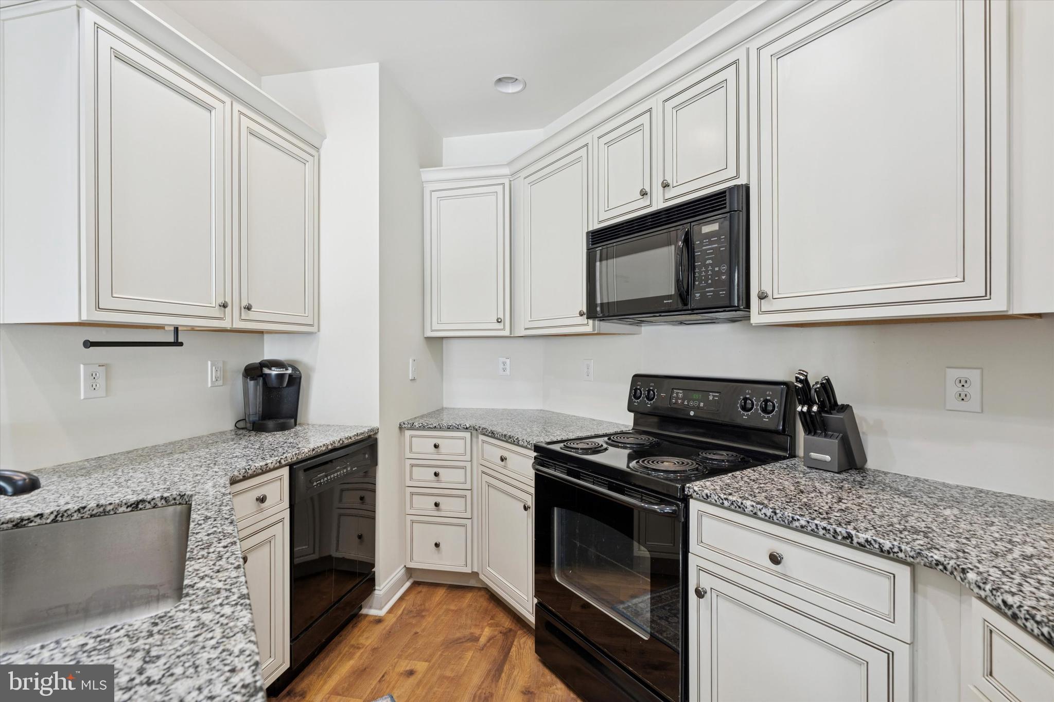 124 Bucktown Xing Road Pottstown, PA 19465 - Photo 8 of 15 a kitchen with granite countertop cabinets stainless steel appliances and a sink