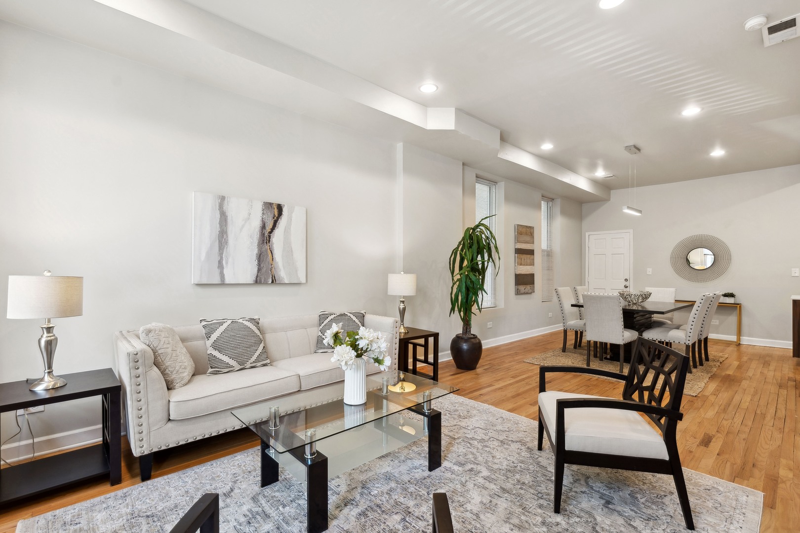 1369 West Crystal Street, Unit 3 Chicago, IL 60642 - Photo 3 of 22 a living room with furniture and a wooden floor