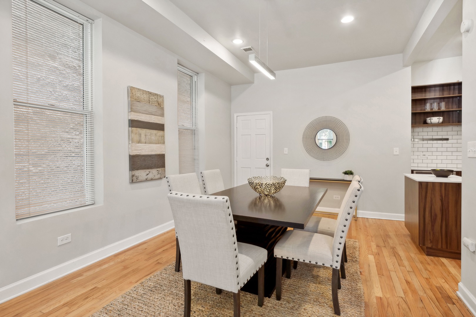 1369 West Crystal Street, Unit 3 Chicago, IL 60642 - Photo 6 of 22 a view of a dining room with furniture and wooden floor